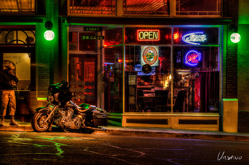 "Horse Envy" - Even the street seems to be running with rivers of green 'envy' as a cowboy contemplates another man's horse parked outside a saloon. The detail in this photo keeps viewers busy for extended periods of time.